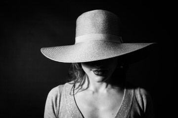 woman with a big hat black and white portrait of a model