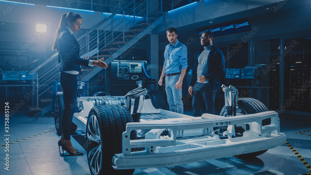 Leinwandbilder international team of automobile design engineers discussing design of autonomous electric car proto