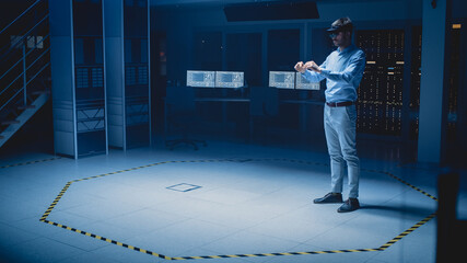 In 3D Content Creating Laboratory Engineer Wearing Professional Virtual Reality Headset Works and Gestures in Augmented Reality. Industrial Software Design Facility