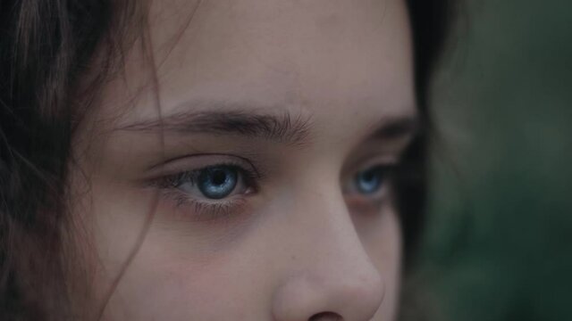 Curly girl Darting blue eyes