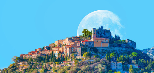 Eze village is a famous tourist destination on French Riviera, full moon in the background - Nice,...