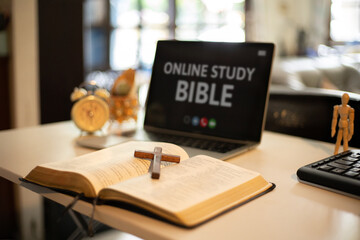 Cross over wood table with window light. online study bible concept.