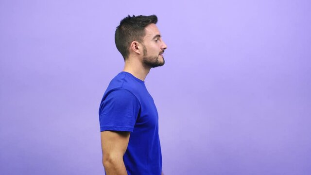 Young caucasian man whispering gossip undertone, trying not to be heard