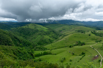Naklejka premium mountain landscape in the summer with cloudy sky