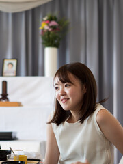 a young woman talking happily while attending an event dinner