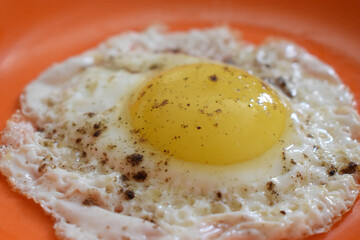 Half Boiled egg on a plate close-up