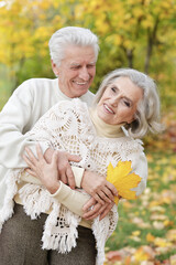 Beautiful senior couple embracing in the park