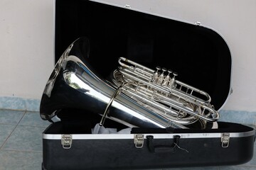 Euphonium instrument with black case