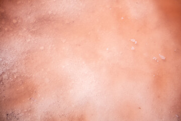 Fototapeta premium background and texture of pink lake, salt covered with water