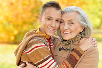 Close up portrait of happy grandmother and grandson posing