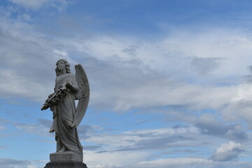 An angel looks at the sky