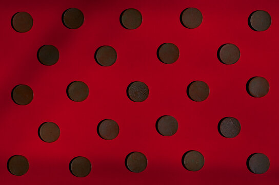 metal circles on a red background. pattern