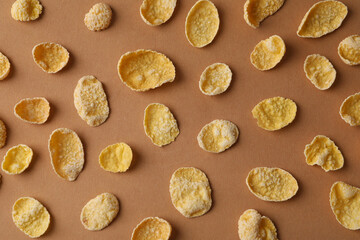 Flat lay with muesli on brown background