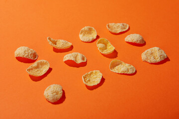 Flat lay with muesli on orange background