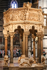 Great close-up view of the Siena Cathedral Pulpit. The octagonal structure with its seven narrative panels and nine decorative columns, was carved out of Carrara marble and sculpted by Nicola Pisano.
