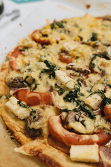 evening meal, Italian pizza, black olives, mozzarella cheese and fresh basil on a wooden background, close up