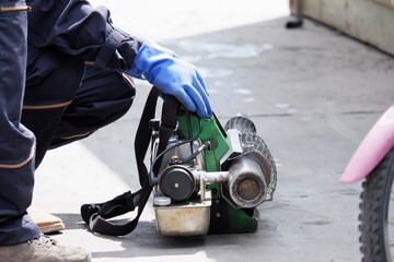 Outdoor health workers in protective clothing using chemical fogging machines to kill mosquitoes.