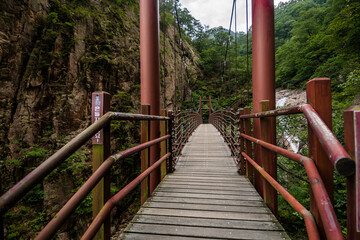 Suspension bridge along the Towangsan Falls trail at Seoraksan National Park in Sokcho, South Korea. 