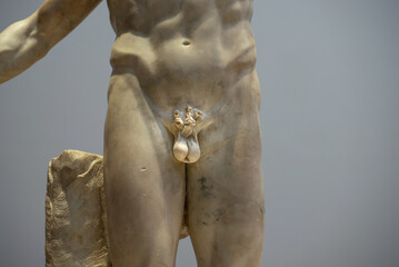 Ancient marble statue of a men without penis. Men health problem concept.