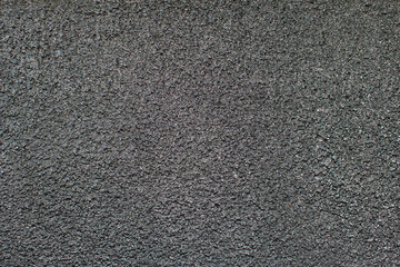 Black abstract background texture of cement or bitumen.