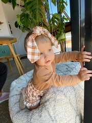 little girl lying on the bed