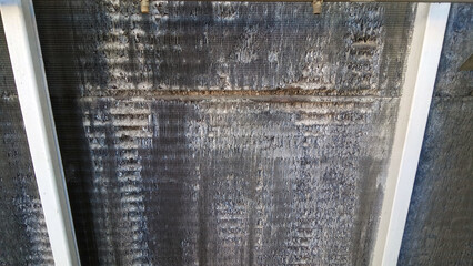 old rusty industrial cooling radiator