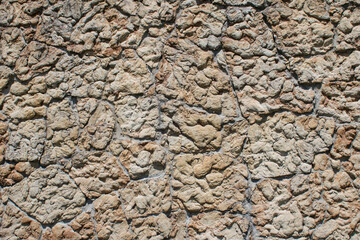 Concrete wall with imprint of decorative pattern rock pattern.