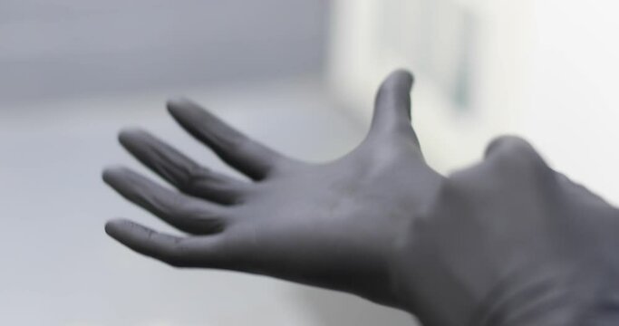 putting on a latex glove