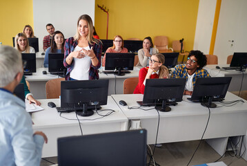 Pupil in classroom talking with teacher