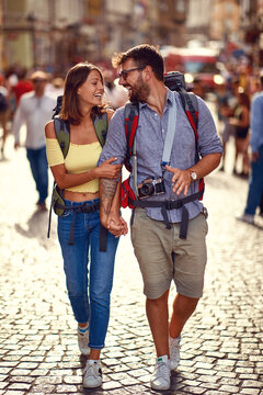 Young tourist couple in love at city streets