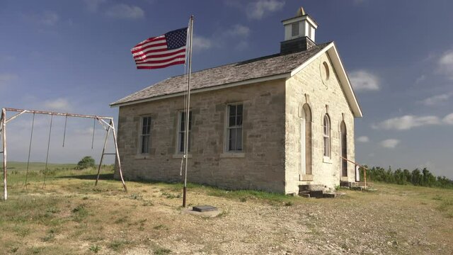 American flag and old school on the prairie