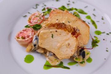 Sliced peanut crusted chicken breast with fresh salad and sauce