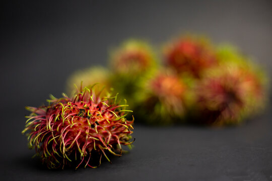 rambutan on black background