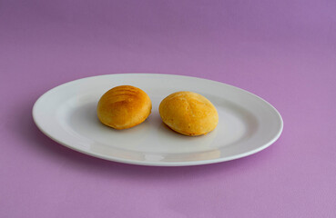 Two cheese bread served on a white plate.