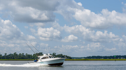 Fototapeta na wymiar Recreational Fishing Boat Returning from a Fishing trip Headed to a Marina