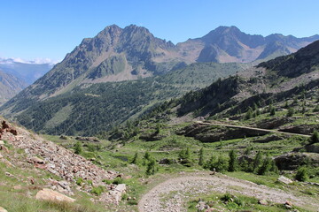 Jaw-droppingly beautiful mountains and lakes in Sant'Anna di Vinadio on a partly cloudy day.
