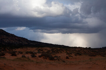 Fototapeta na wymiar Stormy sky and clouds before sunset above the Coral Pink Sand Dunes State Park near Kanab, Utah, USA
