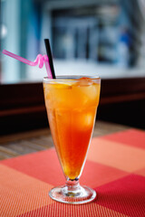 Color refreshing cocktail of vodka, peach liqueur, orange and cranberry juice.