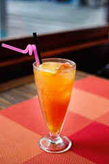 Color refreshing cocktail of vodka, peach liqueur, orange and cranberry juice.