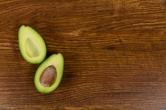 View of an avocado on wood table background