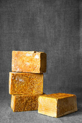 Brown laundry soap on a gray background. Ecological soap. Laundry soap