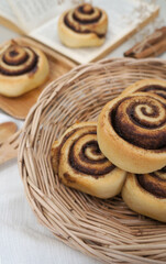 Cinnamon  rolls on a plate from nature on the White table 