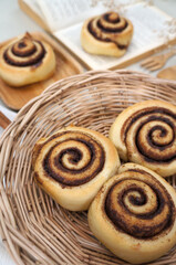 Cinnamon  rolls on a plate from nature on the White table 