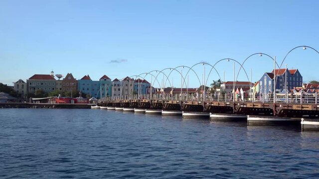 Willemstad, Curacao / Dutch Antilles -  November 18th 2019: Queen Emma floating bridge with Otrobanda in the background.