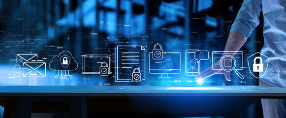Businessman working with modern computer touch screen with Data protection  on blur office background.