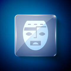 White Mexican mayan or aztec mask icon isolated on blue background. Square glass panels. Vector.