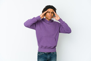 Young african american rasta man touching temples and having headache.