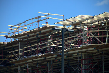 construction site structure worker on metal beams