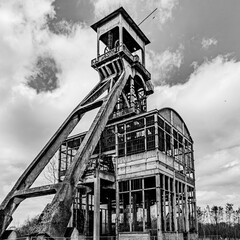 Towers of an old mine undergoing renovation, black and white image, day of history and adventure in Maasmechelen, Belgium