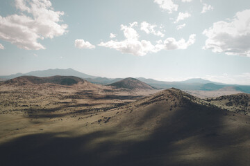 Fototapeta na wymiar volcano desert landscape with clouds